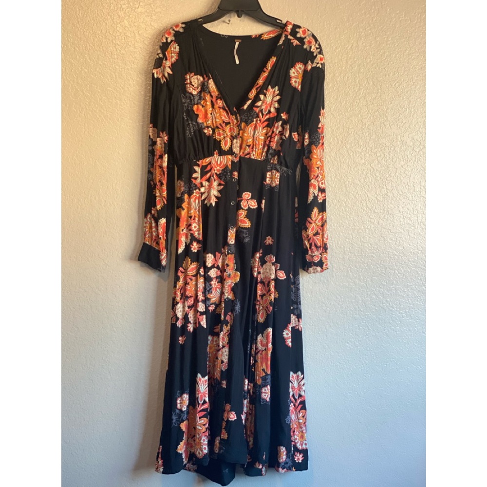 Beautiful long sleeve Free People dress. 1 button missing at the very bottom